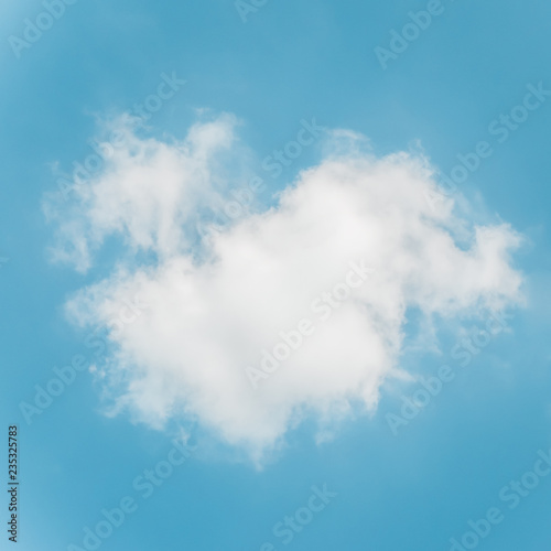 White fluffy cumulus cloud against light blue sky. Square format