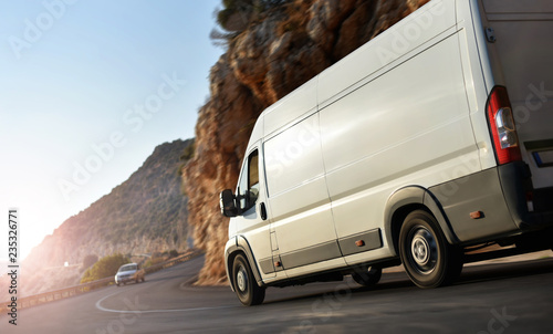 truck delivery van rush by country road photo