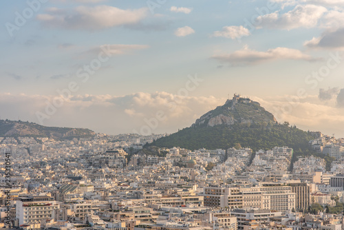 Cityscape wide angle view of the beautiful city of Athens, with Mount Lycabettus in the distance. 