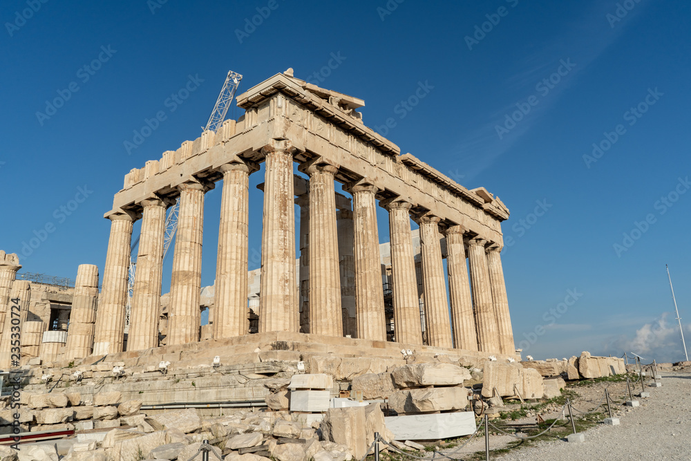 Morning view of the beautiful ancient monument, the Parthenon, with its ionic columns, in the Acropolis in Athens, Greece.