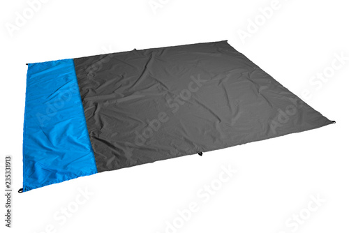 Waterproof and sandproof nylon beach blanket isolated on white background. Very thin tarp or footprint used for outdoor activities. Clipping path included.