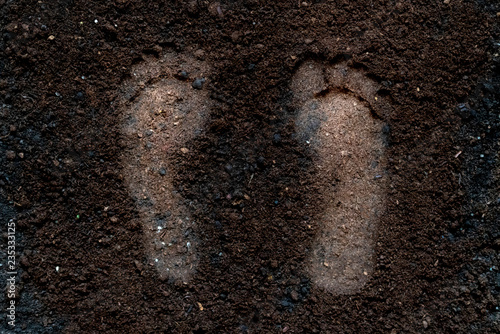 human bare foot step print on the soil ground f