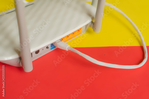 close up white wi-fi router isolated on the color background f