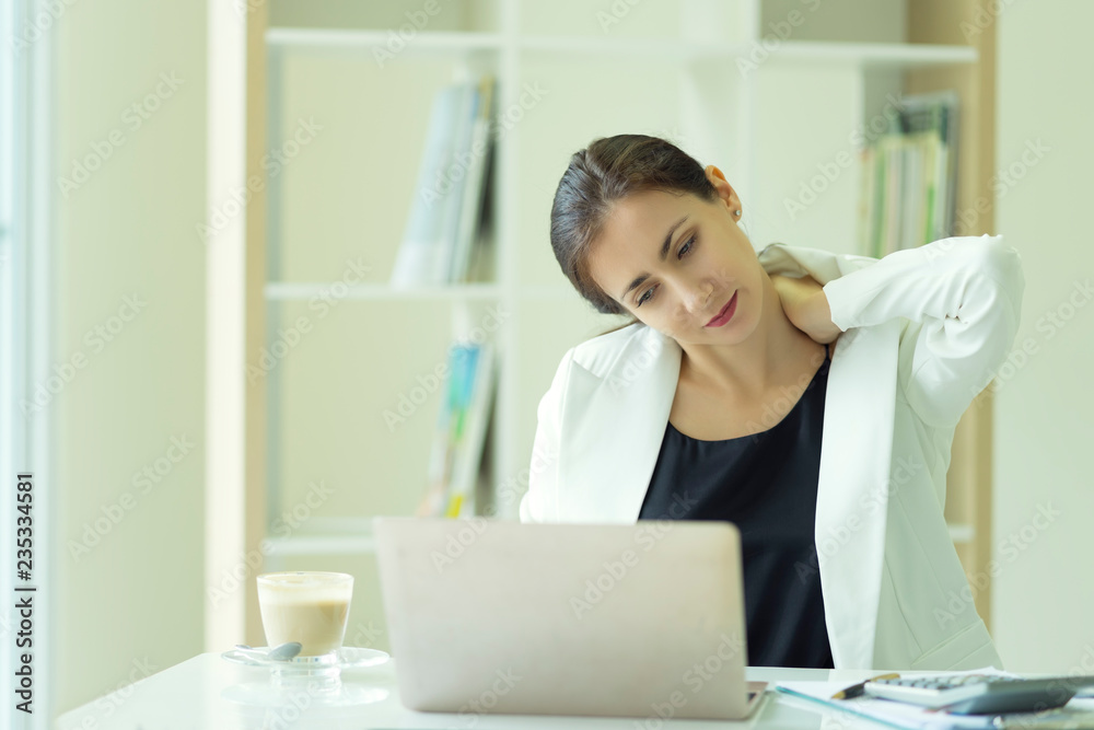 Businesswoman feeling pain in neck, tired woman suffering of office syndrome after long hours work. Health concept. Businesswoman feeling pain in neck, tired woman suffering of office syndrome after long hours work. Health concept.