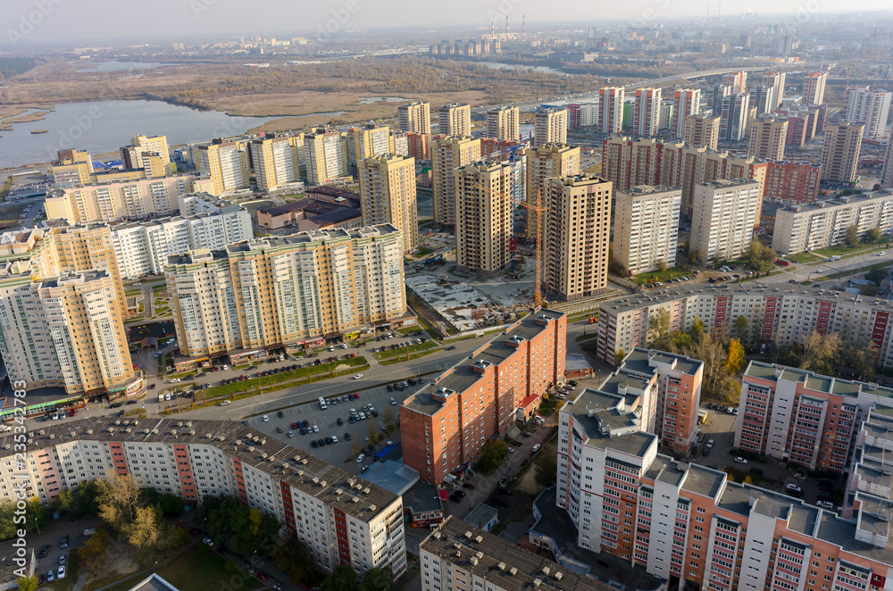 Fototapeta premium Tyumen, Russia - October 11, 2017: Aerial view of city quarters on Solnechniy proezd