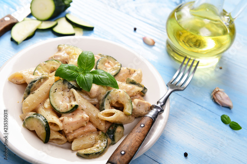 Penne pasta witch chicken and zucchini in cheese sauce