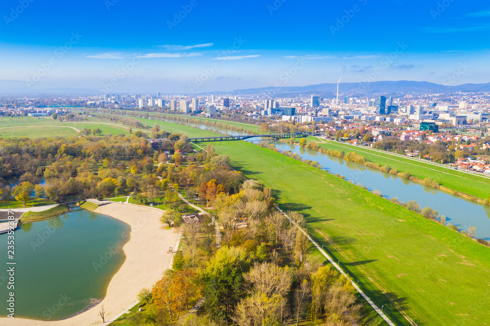 Croatia, Zagreb city, panoramic aerial view of Bundek lake in autumn from drone