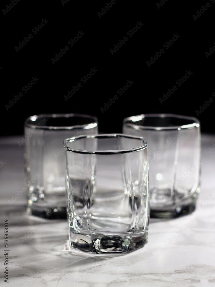 Empty old fashion glass on black background Empty old fashion glass on black background