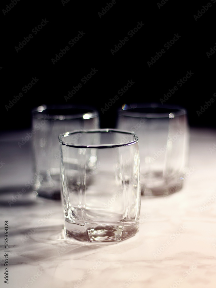 Empty old fashion glass on black background Empty old fashion glass on black background