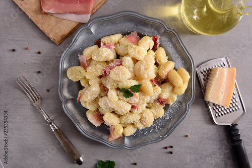 Gnocchi with prosciutto ham and cheese sauce photo