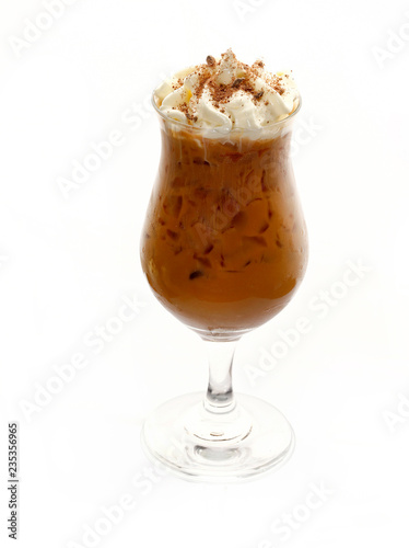 Iced coffee in glass with whipped cream isolated on white background