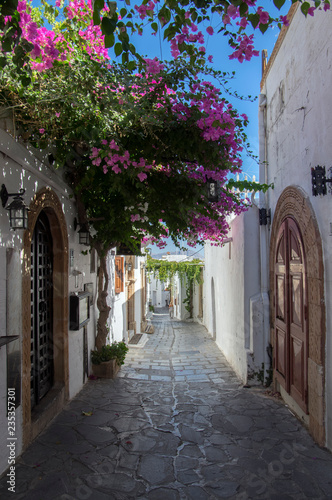 Lindos village streets without tourists, beautiful white houses and narrow streets during summer season