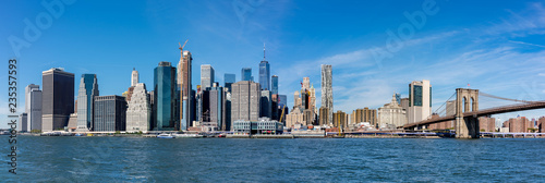 Panoramic view of New York City Manhattan skyline and Brooklyn bridge. © borisbelenky