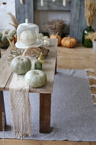 autumn huge decorated living room with white pumpkin