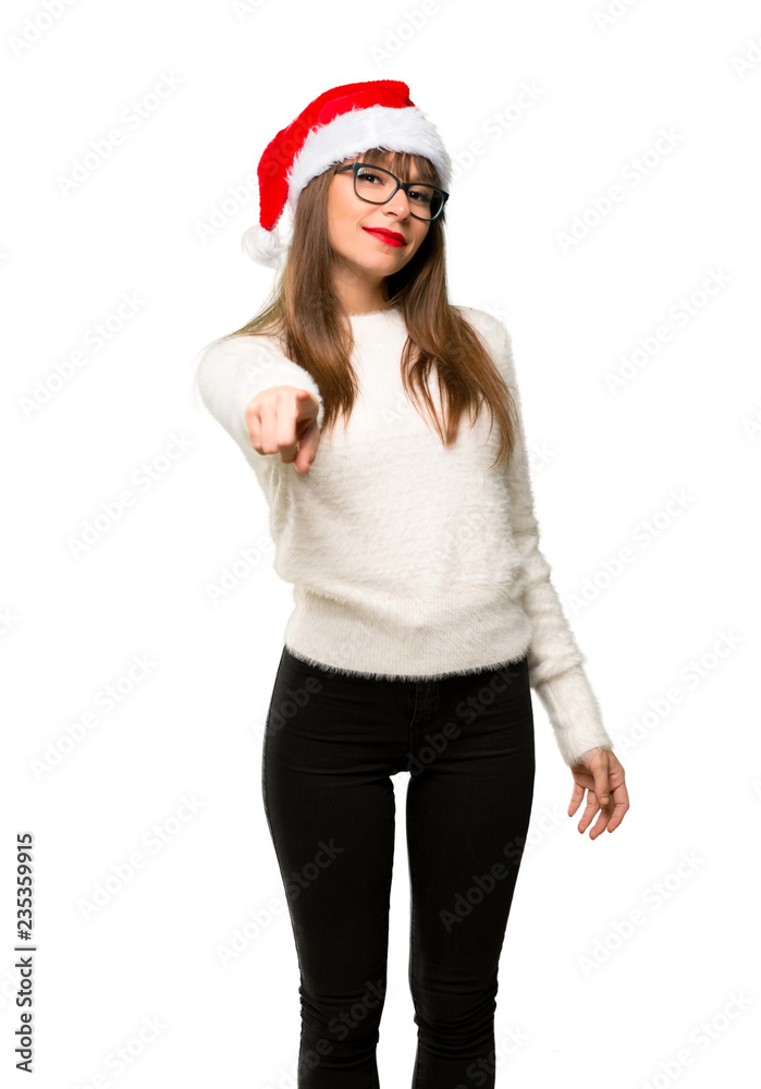 Girl with celebrating the christmas holidays points finger at you with a confident expression on isolated white background Girl with celebrating the christmas holidays points finger at you with a confident expression on isolated white background