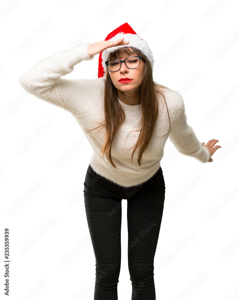 Girl with celebrating the christmas holidays looking far away with hand to look something on isolated white background Girl with celebrating the christmas holidays looking far away with hand to look something on isolated white background
