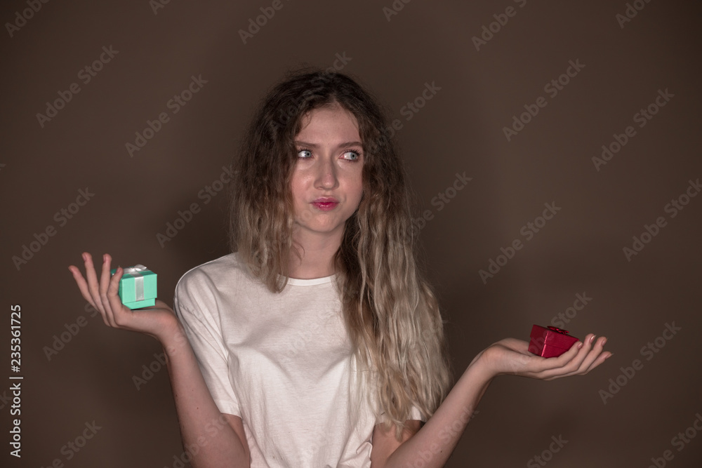 The portrait of a young girl with two gift surprise present boxes The portrait of a young girl with two gift surprise present boxes