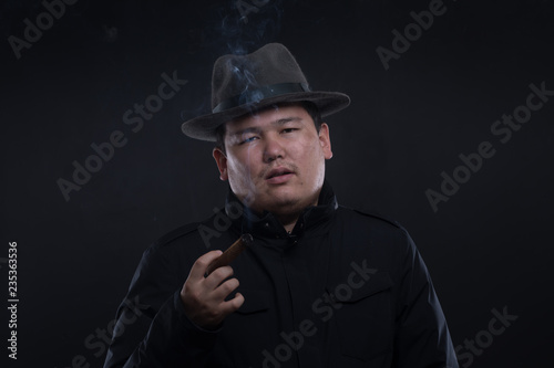 Asian man with a cigar