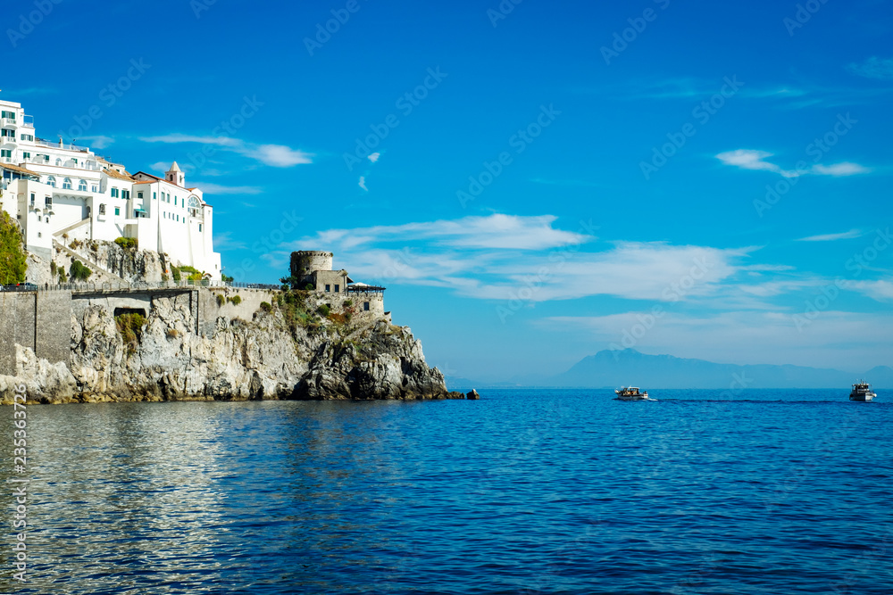 Amalfi village with houses, located on rock, Amalfi coast with Gulf of Salerno.