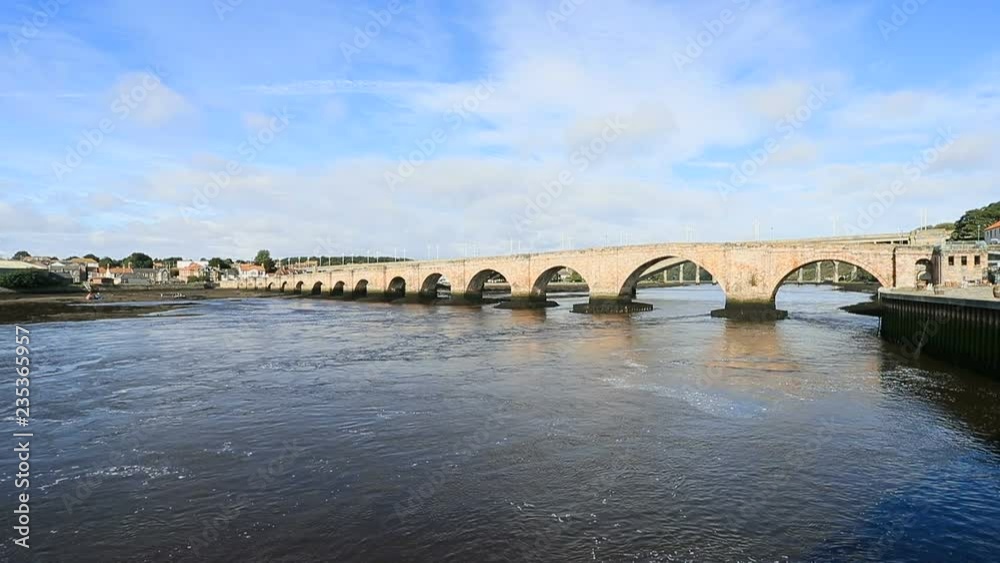 Berwick Upon Tweed England old bridge river low tide. Northernmost town in England at the mouth of the River Tweed. An Anglo Saxon settlement from 10th century. Traditional market town. Berwick Upon Tweed England old bridge river low tide. Northernmost town in England at the mouth of the River Tweed. An Anglo Saxon settlement from 10th century. Traditional market town.