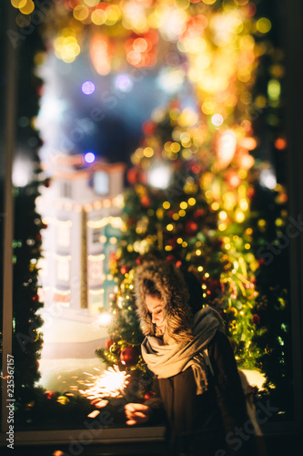 Female holding burning sparkler