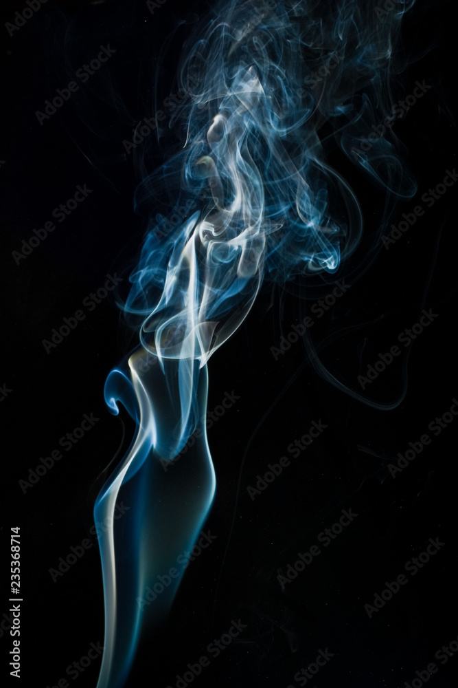 Obraz premium Blue smoke isolated on black background