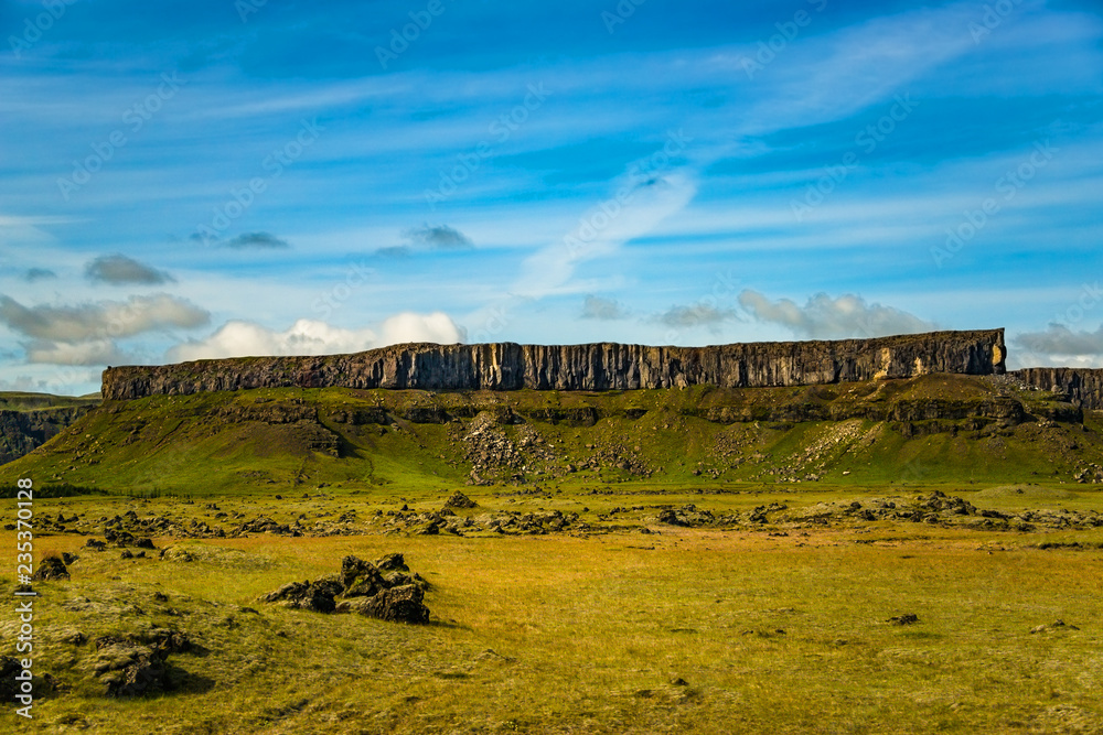 Naklejka premium Icelandic colorful landscape on Iceland with basalt columns rock at sunset, summer time