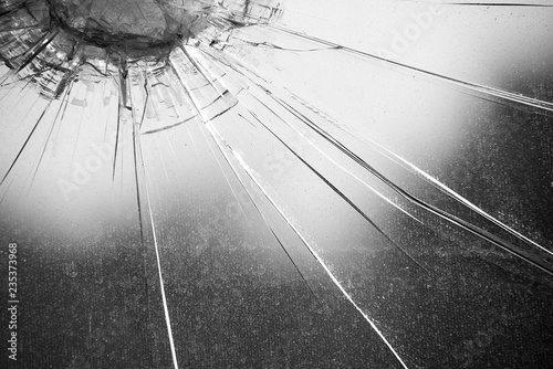 Monochrome surface of cracked thick glass photo