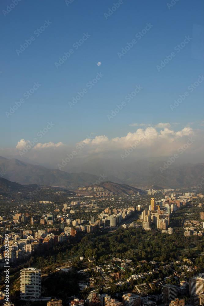 View of Santiago de Chile with the Andes Mountains in the distance during the golden hour.