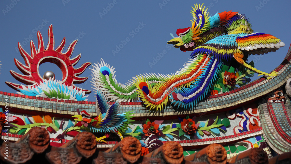 Chinaware mosaic arts and decoration showing a bird in a buddhist temple as symbolic and religous elementand in downtown Taichung, Taiwan