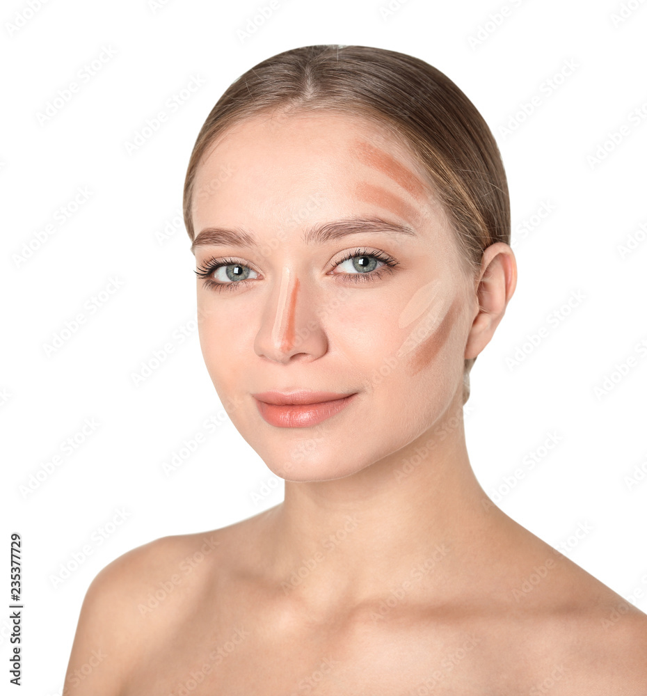 Portrait of beautiful young woman with makeup contouring smears on face against white background Portrait of beautiful young woman with makeup contouring smears on face against white background