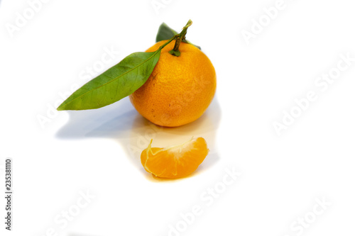 Tangerines with twigs and leaves. Just tangerines.