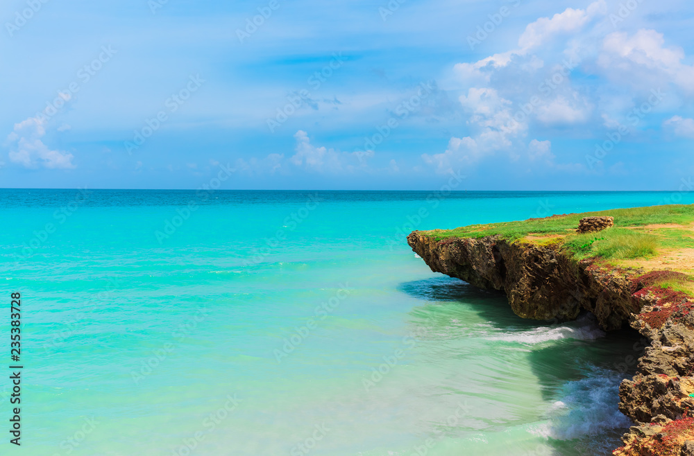natural amazing beautiful landscape view on tranquil turquoise ocean and cliff with blue cloudy sky background in Varadero, Cuban beach
