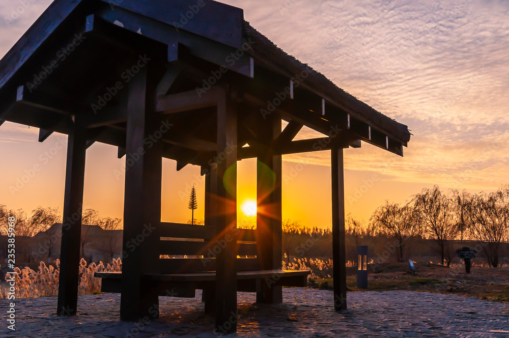 Winter sunset and wooden pavilion - China Changchun Beihu National Wetland Park