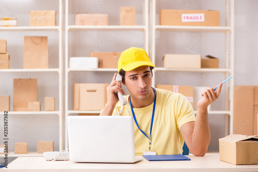 Handsome contractor working in box delivery relocation service 