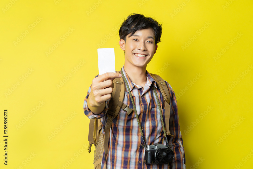 Asian tourists tickets are using credit cards to book a place to travel. Asian tourists tickets are using credit cards to book a place to travel.