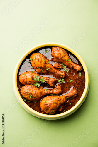 Chicken leg / drumstick curry or Murg Tangri/tangdi masala. Served in a bowl over moody background. Selective focus