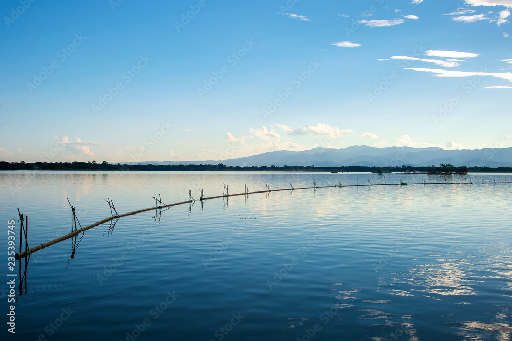 Beautiful View of Kwan Phayao, Thailand with soft-focus and over light in the background Beautiful View of Kwan Phayao, Thailand with soft-focus and over light in the background