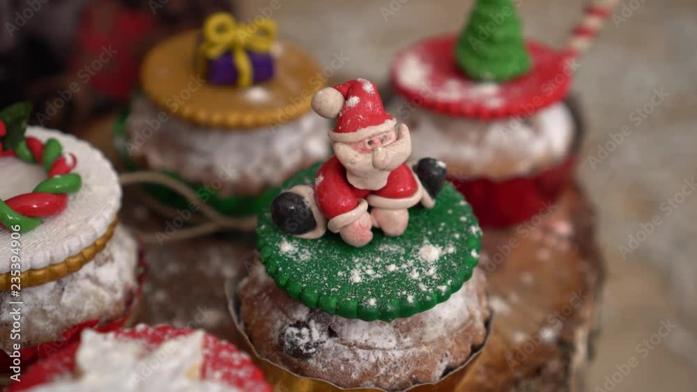 Christmas decorated cupcakes. Holiday food. Festive lights. New year party