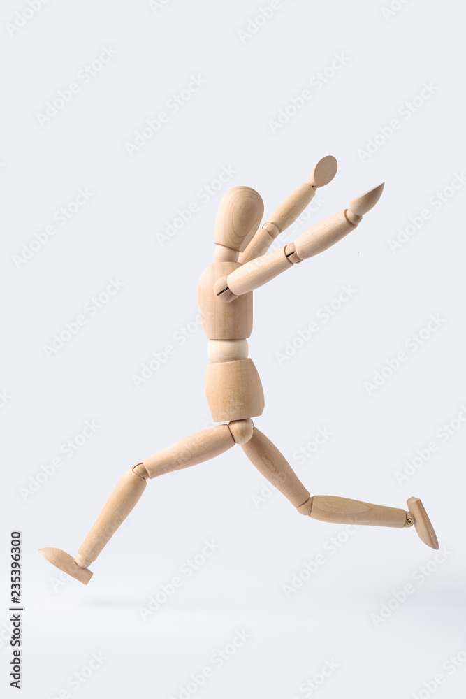 running wooden mannequin isolated on white background running wooden mannequin isolated on white background