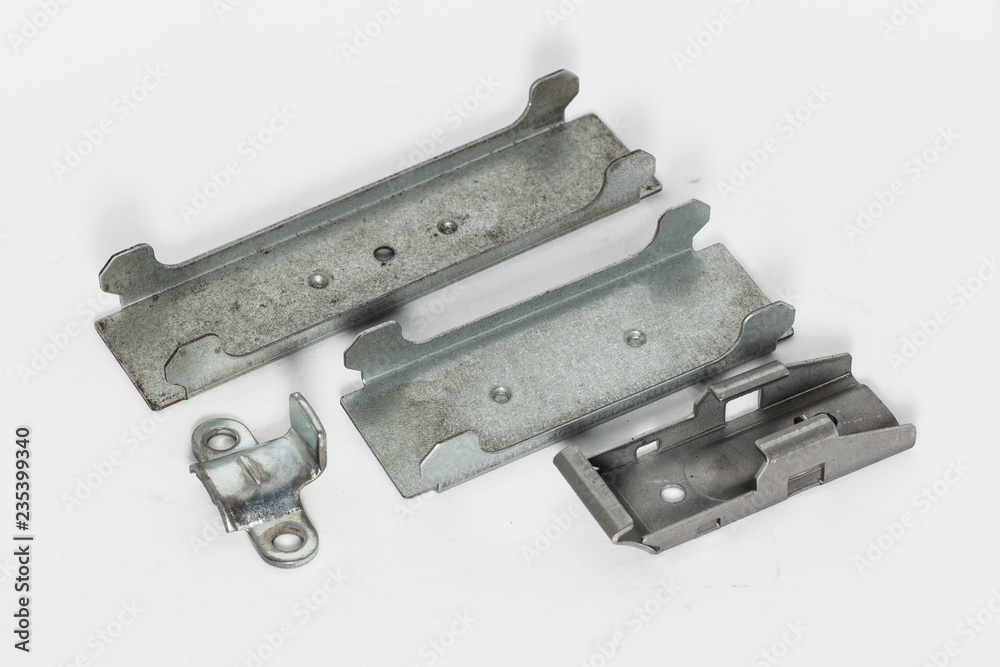 Metal part from press machine in white background. Metal part from press machine in white background.