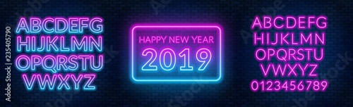 Neon sign happy new year on a dark background with bright alphabets.