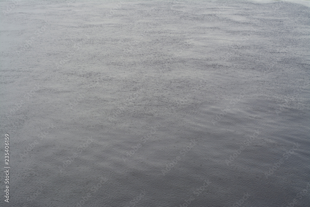 Texture of dark water with light waves Texture of dark water with light waves