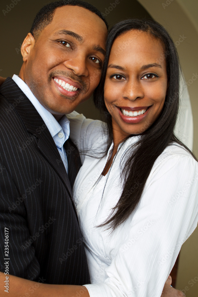 Portrait of a Happy African American couple smiling and hugging. Portrait of a Happy African American couple smiling and hugging.