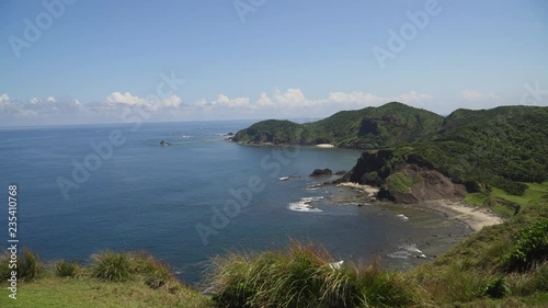 Wallpaper Mural Coast of tropical island Palau with wild beaches, mountains covered with rainforest and trees. Santa Ana, Philippines. Island with wild beaches. Torontodigital.ca