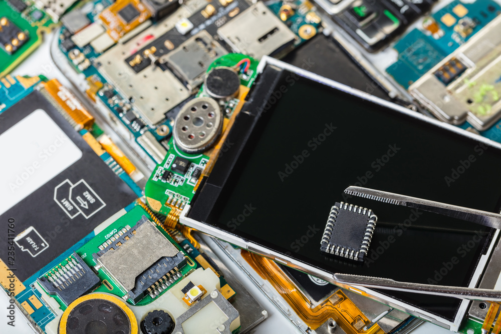 electronic chip in tweezers electronic chip in tweezers