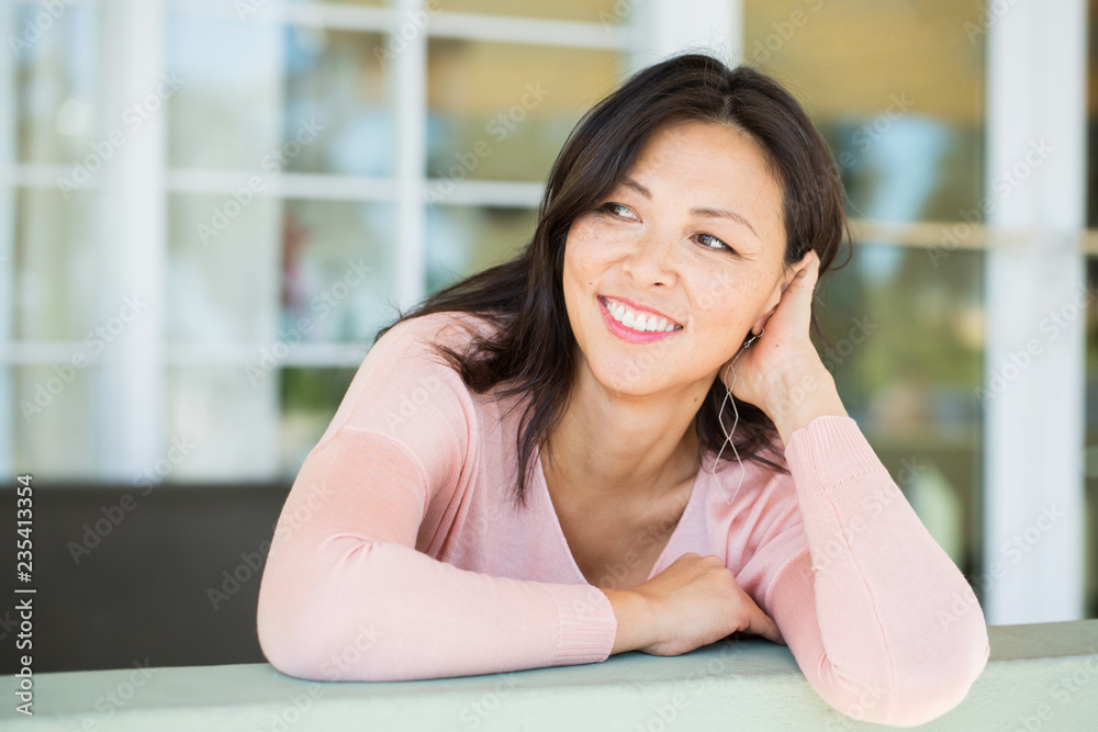 Portrait of a beautiful Asian woman smiling.