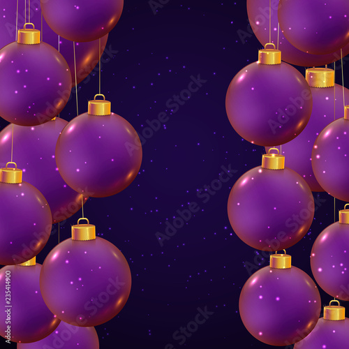 Christmas balls in violet color on dark blue