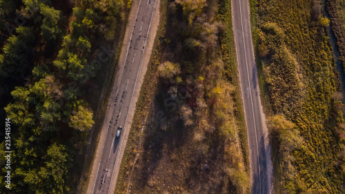 Aerial view of the road through fall forest