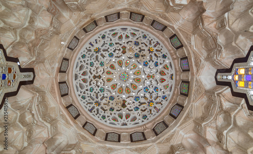 Ottoman era carved plaster dome decorated with colored glass pieces of a pergola in front of El sehemy historical house, El Moez street, Cairo, Egypt photo